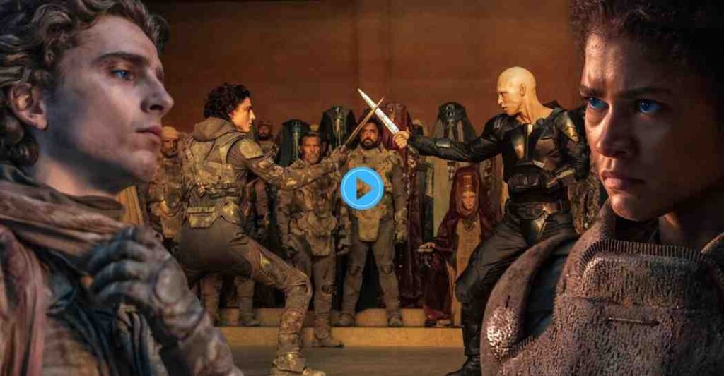 The final duel in Dune: Part Two between Paul Atreides and the bald Feyd-Rautha, watched by a crowd of Fremen and Harkonnens, with Paul and Chani's faces prominent on the sides.